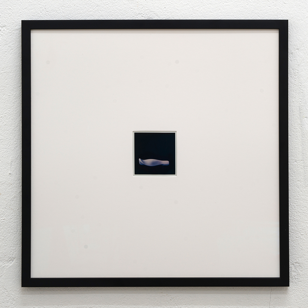 <em>Handle #1,</em> Polaroid sx-70, 40x40 cm, (framed) 8,1x8,4 cm (unframed), 2024.