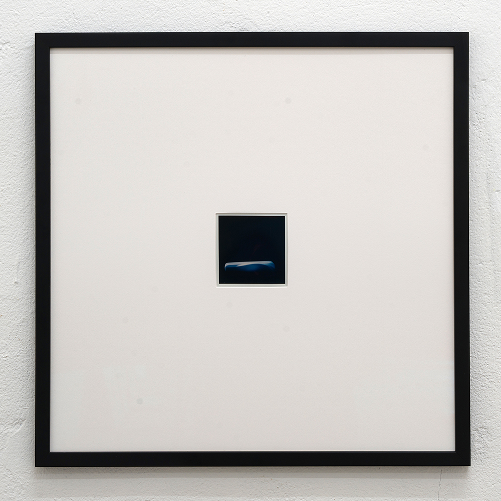 <em>Handle #3,</em> Polaroid sx-70, 40x40 cm, (framed) 8,1x8,4 cm (unframed), 2024.